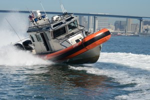 US Coast Guard shoots out migrant boat engine in high speed chase
