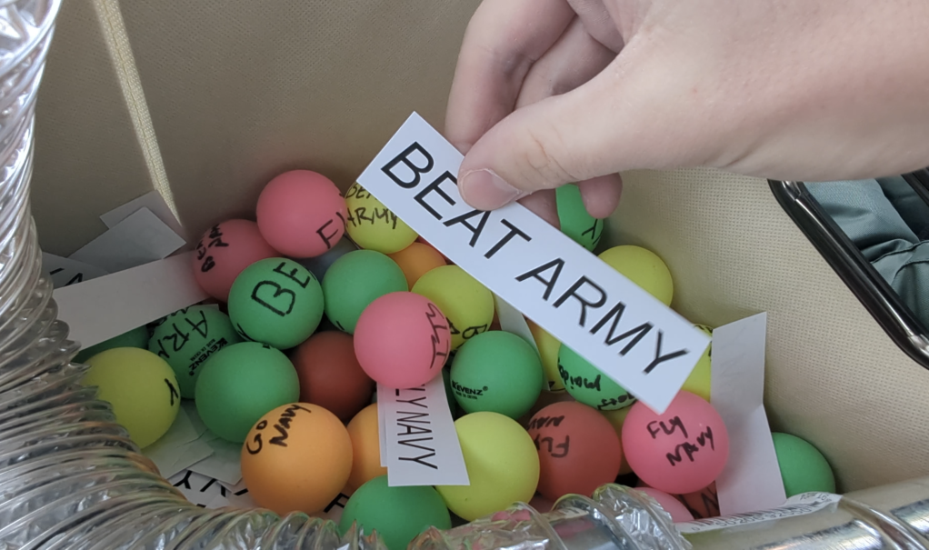 Midshipmen drop leaflets, Ping-Pong balls on cadets ahead of big game