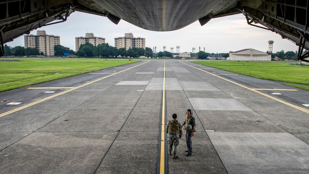 On the ground at Yokota Air Base, the Air Force transport hub of the Pacific