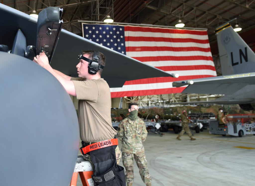 Big pay raise, limits on troop moves highlight defense budget measure