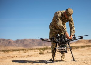 Don’t ditch soldiers for machines, combine them, Rainey says