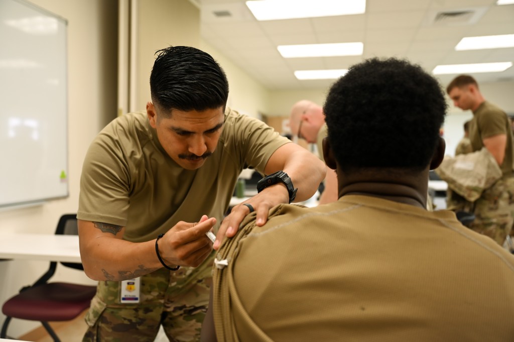 Following an outbreak, lawmakers push to require flu vaccine for all service members in budget bill provision