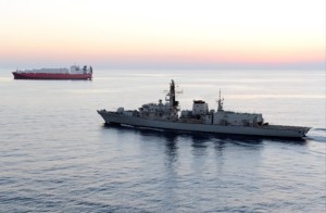 Britain says Iranian vessels tried to block tanker in Gulf