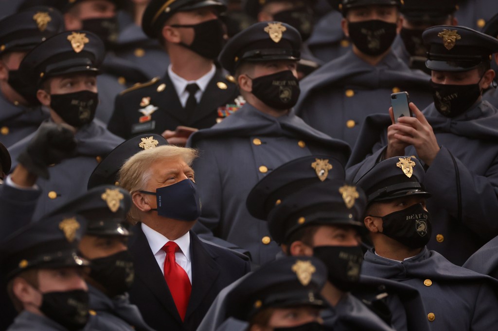 Trump repeats his vow to veto the defense budget bill, but won’t say when