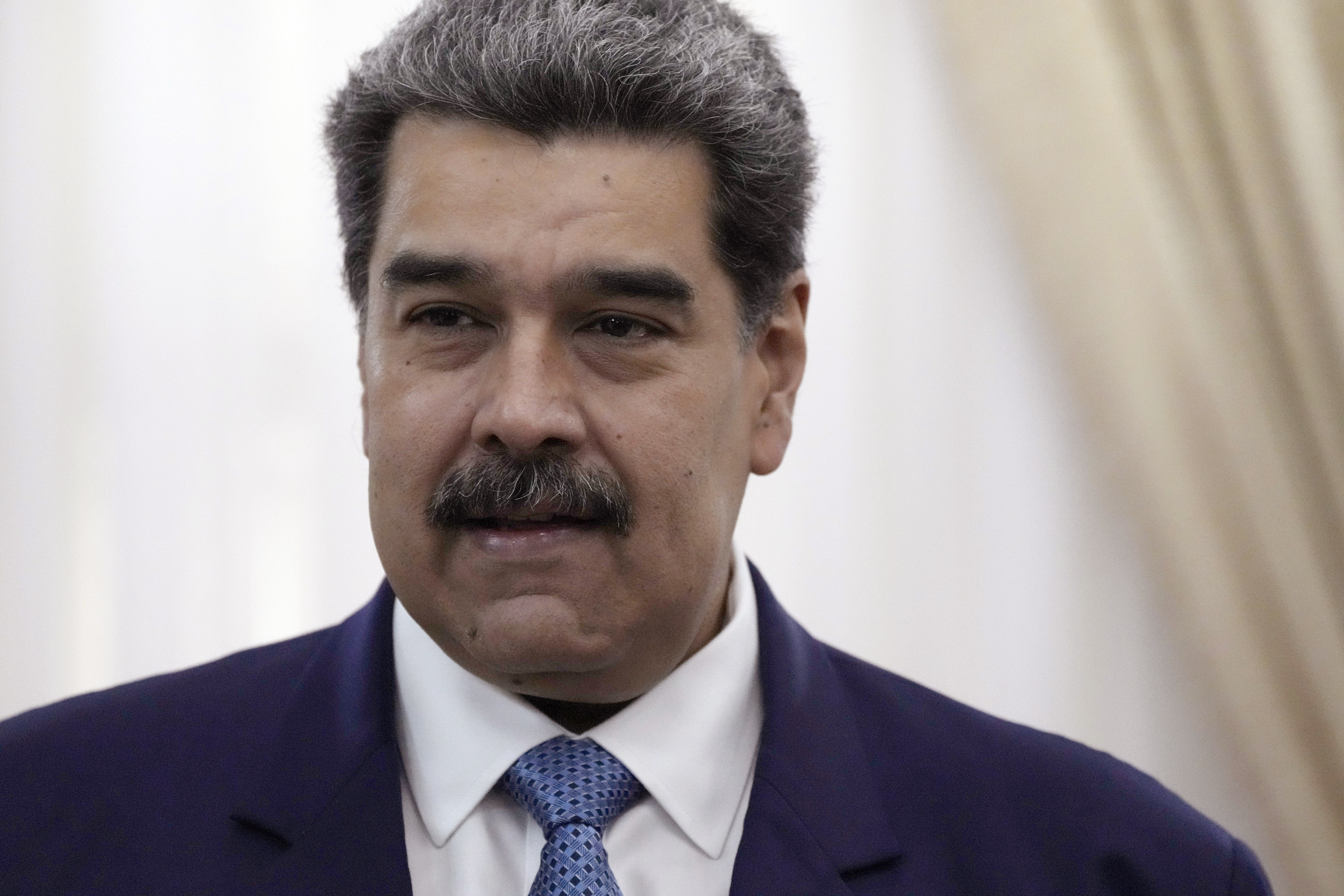 Venezuelan President Nicolas Maduro stands before a meeting at the presidential palace in Caracas, Venezuela, on July 11, 2022.