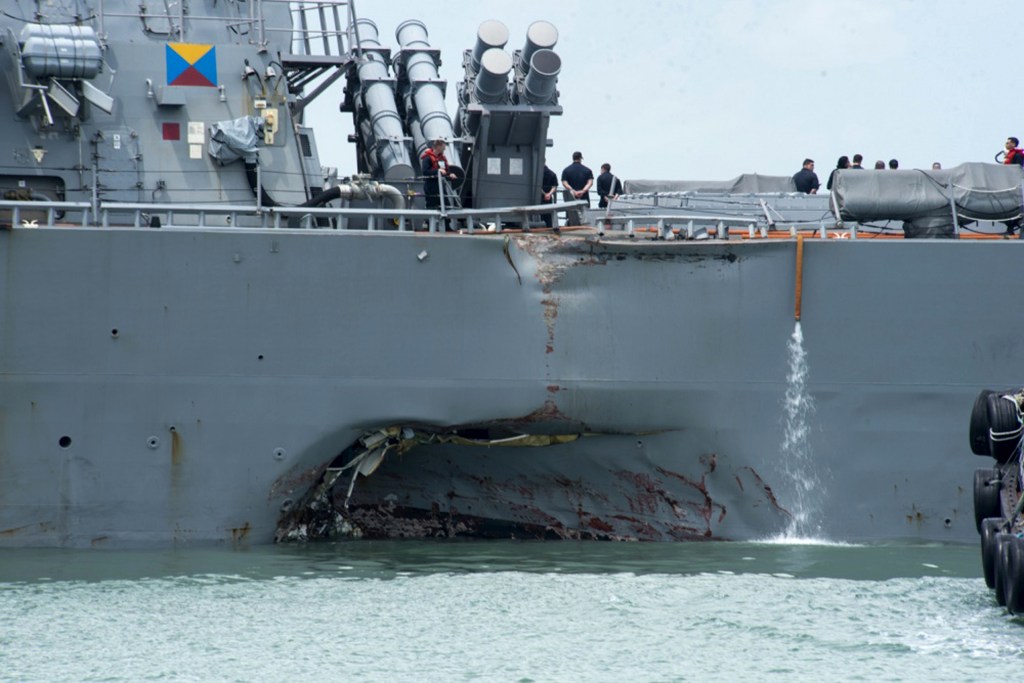 Stricken destroyer John S. McCain arrives in Singapore, 10 crew still missing