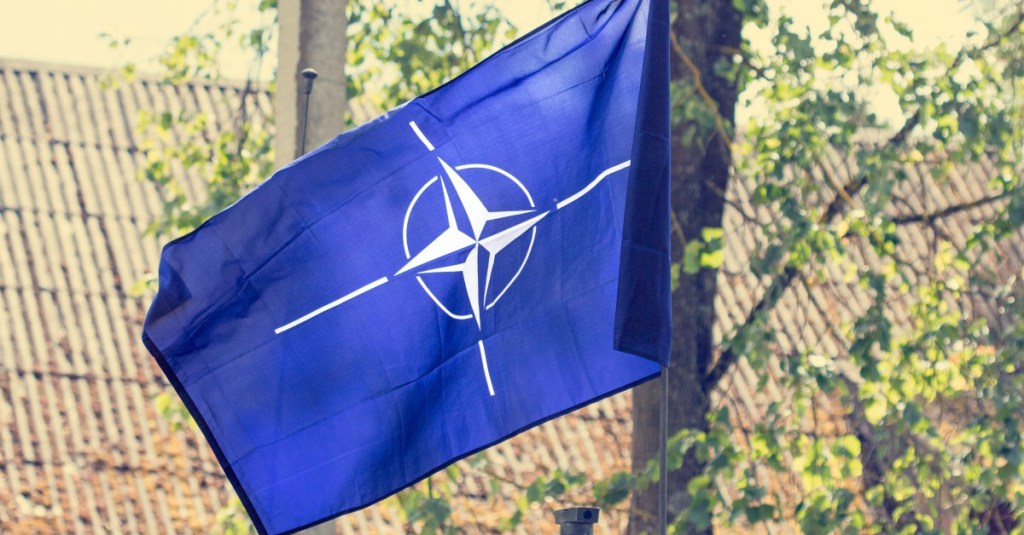 How much do NATO member nations spend on defense?