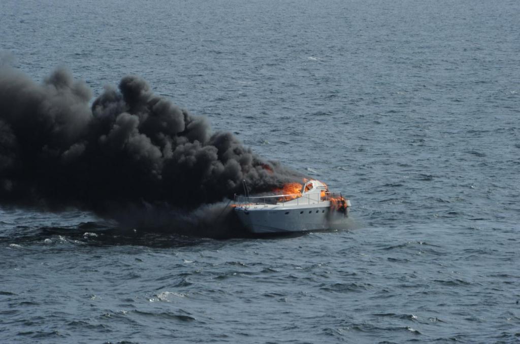 Navy:  Warship Ross rushes to rescue mariners from burning boat