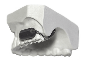 This new wireless communication device fits on your teeth
