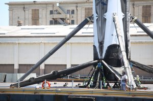 Recovered SpaceX booster arrives aboard drone ship